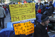 A protester post a sign about the cost of war, reflecting the range of issues found among participants of the Occupy Wall Street protest at Zuccotti Park, Tuesday, Oct. 25, 2011 in New York. Some businesses and residents are losing patience with the protesters in Zuccotti Park, the unofficial headquarters of the movement that began in mid-September. (AP Photo/Bebeto Matthews)