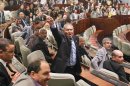 A delegate shouts at other delegates protesting the results of the last parliamentary election, during the opening session of the new National Assembly in Algiers