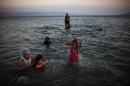 Arab-Israelis swim in the Sea of Galilee in northern Israel on September 2, 2011
