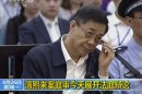 In this image taken from video, former Chinese politician Bo Xilai looks up in a court room at Jinan Intermediate People's Court in Jinan, eastern China's Shandong province, Monday, Aug. 26, 2013. A prosecutor urged a Chinese court Monday to punish disgraced politician Bo with a severe sentence because of his lack of remorse over alleged corruption and abuse of power, in a trial that has offered a glimpse into the shady inner workings of China's elite. (AP Photo/CCTV via AP Video) CHINA OUT, TV OUT