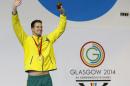 Australia's James Magnussen celebrates with the gold medal after winning the Men's 100m Freestyle swimming competition at the Tollcross International Swimming Centre during the Commonwealth Games 2014 in Glasgow, Scotland, Sunday July 27, 2014. (AP Photo/Kirsty Wigglesworth)