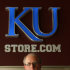 Paul Vander Tuig, trademark licensing director at Kansas University, pose for a photograph by the gift store at Allen Fieldhouse in Lawrence, Kan. With the launch of the first public sale of .xxx domains, Kansas University has purchased .xxx domains to protect its school and brand from being linked to pornographic sites. (AP Photo/Ed Zurga)