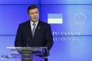 Ukrainian President Yanukovich addresses a news conference during an EU-Ukraine summit in Brussels