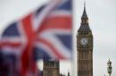 A Union Jack flies in front of the Houses of Parliament in central London
