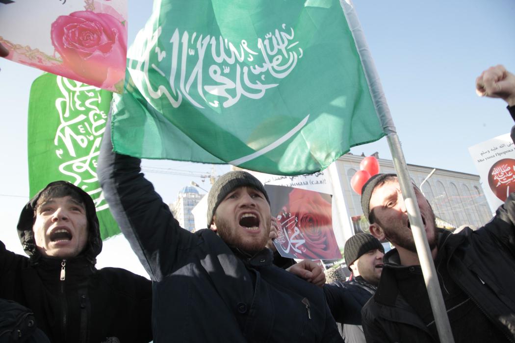 Chechen Muslims gather in downtown regional capital of Grozny to take part in a protest rally on Monday, Jan. 19, 2015. Protesters have gathered in...