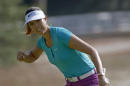 Michelle Wie reacts as she makes a birdie putt on the 17th hole en route to winning the U.S. Women's Open golf tournament in Pinehurst, N.C., Sunday, June 22, 2014. (AP Photo/John Bazemore)