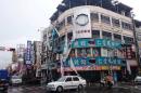 Damaged advertisement banners are seen after strong winds and rain from Typhoon Nepartak hit Taitung