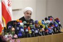 Iranian President-elect Hassan Rohani speaks with the media during a news conference in Tehran