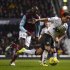 West Ham United's Alou Diarra challenges Manchester United's Rafael during their FA Cup third round soccer match in London