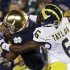 Notre Dame's TJ Jones makes a catch against Michigan's Raymon Taylor during the first half of an NCAA college football game Saturday, Sept. 22, 2012, in South Bend, Ind. (AP Photo/Darron Cummings)