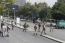 Egyptian Army soldiers block roads as former president Mubarak is transported back to a military hospital after a court hearing in Maadi, on the outskirts of Cairo
