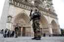 Soldiers patrol in front of the Notre Dame Cathedral in Paris