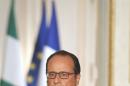 French President Francois Hollande attends a joint media conference with Nigerian President Muhammadu Buhari at the Elysee Palace in Paris, France, Monday, Sept. 14 , 2015. (AP Photo/Jacques Brinon)