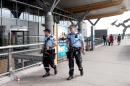 Armed police patrol outside Oslo Airport on July, 24, 2014 amid warnings of a terror plot