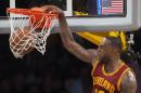 Cleveland Cavaliers' LeBron James dunks over Los Angeles Lakers' Julius Randle during an NBA basketball game Thursday, March 10, 2016, in Los Angeles. (Kevin Sullivan/The Orange County Register via AP) MAGS OUT; LOS ANGELES TIMES OUT; MANDATORY CREDIT