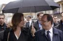 File photo of France's President Hollande and his companion Valerie Trierweiler in Tulle