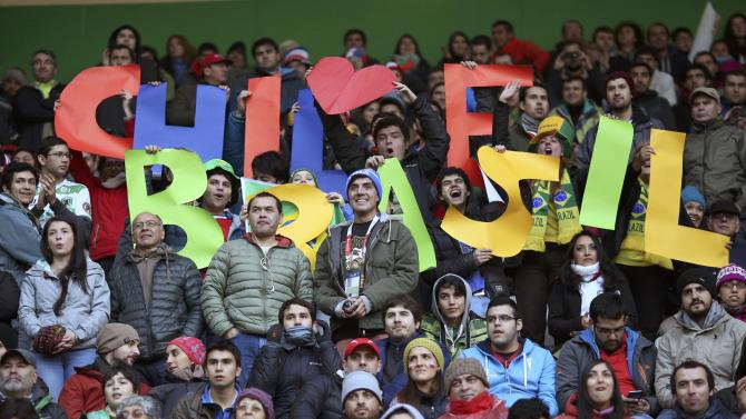Fans of Chile and Brazil await the start of the first round Copa America 2015 soccer match between Brazil and Peru at Estadio Municipal Bicentenario German Becker in Temuco