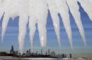 Chicago skyline is framed by icicles in Chicago
