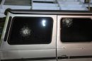 Gun shots are seen on the windows of the Italian consul's car after it was shot by unknown assailants in Benghazi
