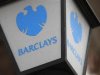 A lamp featuring a logo of Barclay's bank is seen outside a branch in London