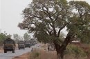 A convoy of French military vehicles heads toward Sevare in the village of Somadougou