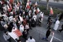 Members of Bahrain's Al-Wefaq opposition group takes part in an anti-government protest in the village of Shakhora, west of Manama, on January 3, 2014