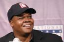 Chicago White Sox slugger Frank Thomas smiles as he listens to a question during a news conference about his selection into the MLB Baseball Hall Of Fame Wednesday, Jan. 8, 2014, at U.S. Cellular Field in Chicago. Thomas joins Greg Maddux and Tom Glavine as first ballot inductees Wednesday, and will be inducted in Cooperstown on July 27 along with managers Bobby Cox, Joe Torre and Tony La Russa, elected last month by the expansion-era committee. (AP Photo/Charles Rex Arbogast)