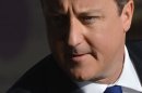 Britain's Prime Minister Cameron arrives at the Conservative Party conference in Birmingham, central England