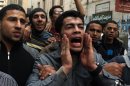 Mourners react during the funeral of 15-year-old Islam Massoud in the Egyptian town of Damanhour