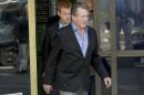 FILE - This Dec. 12, 2013 file photo shows actor Ryan O'Neal, center, followed by his son, Redmond O'Neal, as they exit court for a lunch break in Los Angeles. A jury told a judge on Wednesday Dec. 18, 2013, that there is disagreement and seemingly a "standstill" in deliberations over ownership of an Andy Warhol portrait of Farrah Fawcett that is currently held by Ryan O'Neal. The University of Texas at Austin and O'Neal believe they are rightful owner of an Andy Warhol portrait of the late Farrah Fawcett. (AP Photo/Damian Dovarganes, File)