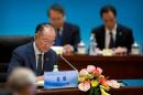 World Bank President Jim Yong Kim attends the 1+6 Roundtable on promoting growth in the Chinese and global economies at the Diaoyutai State Guesthouse in Beijing