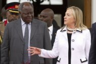 US Secretary of State Hillary Clinton (R) meets with Kenyan President Mwai Kibaki at the State House in Nairobi. Clinton has urged Kenyans to work together to ensure "transparent" elections next year and avoid a repeat of the deadly post-poll violence four years ago. (AFP Photo/Jacquelyn Martin)