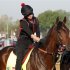 Exercise rider Jenn Patterson gives Kentucky Derby hopeful Orb a pat during morning workouts in Louisville