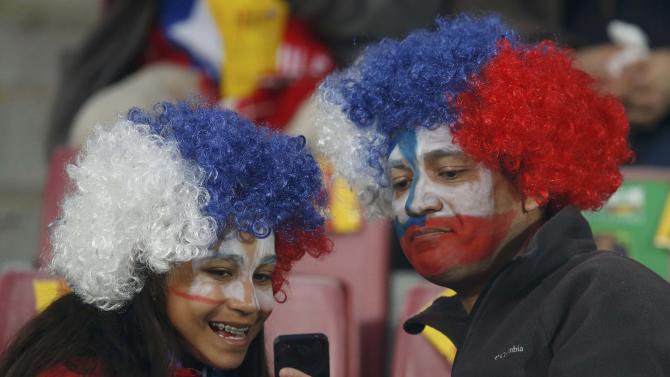 Chile fans take a selfie before the opening soccer match against Ecuador in the Copa America Chile 2015 at National Stadium in Santiago