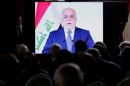 Iraqi Prime Minister Haider al-Abadi is seen on a screen as he speaks via a videoconference during a ministerial summit to hold discussion on the future of Mosul city, post-Islamic State, in Paris
