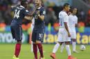 France's Karim Benzema (10) dances with Blaise Matuidi (14) after scoring the third goal during the group E World Cup soccer match between France and Honduras at the Estadio Beira-Rio in Porto Alegre, Brazil, Sunday, June 15, 2014. (AP Photo/David Vincent)