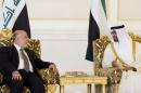 In this image released by the Emirates News Agency, WAM, Iraqi Prime Minister Haider al-Abadi, left, meets with Sheikh Mohamed bin Zayed Al Nahyan Crown Prince of Abu Dhabi and Deputy Supreme Commander of the UAE Armed Forces in Abu Dhabi, United Arab Emirates, Monday, Dec. 15, 2014. (AP Photo/WAM)