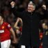 Manchester United's manager Ferguson celebrates after his team clinched the English Premier League soccer title with a win against Aston Villa at Old Trafford in Manchester
