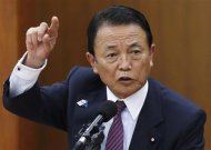 Japan's Finance Minister Taro Aso speaks during a semi-annual parliament hearing on monetary policy at the Lower House of the parliament in Tokyo June 19, 2013. REUTERS/Issei Kato