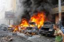 Cars burn following an explosion in Haret Hreik, a south Beirut neighbourhood considered a stronghold of the Lebanese Shiite movement Hezbollah, on January 21, 2014