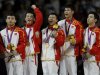 China's gymnasts celebrate with their gold medals after taking first place in the men's gymnastics team final at the London 2012 Olympic Games
