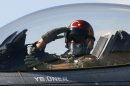 FILE - In this April 29, 2010 file photo, a Turkish pilot salutes before take-off at an air base in Konya, Turkey. Turkish President Abdullah Gul said Saturday June 23, 2012, his country would take "necessary" action against Syria for the downing of a Turkish military jet, but suggested that the aircraft may have unintentionally violated the Syrian airspace. The plane went down in the Mediterranean Sea about 8 miles (13 kilometers) away from the Syrian town of Latakia, Turkey said. (AP Photo/File)