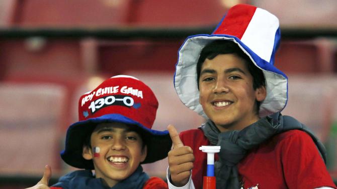 Chile fans await the start of their team&#39;s first round Copa America 2015 soccer match against Bolivia at the National Stadium in Santiago