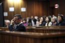 Oscar Pistorius reacts during his trial at North Gauteng High Court in Pretori