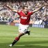 Manchester United's Owen celebrates after scoring during their English Premier League soccer match against Bolton Wanderers at the Reebok Stadium in Bolton