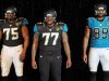 Jacksonville Jaguars players Eugene Monroe, left,  Uche Nwaneri, center,  and Marcedes Lewis, right, model variants of the Jacksonville Jaguars new uniforms during their reveal.  The Jacksonville Jaguars previewed the team's new Nike designed uniforms Tuesday afternoon in the West Touchdown  Club at EverBank Field, April 23, 2013.  (AP Photo/The Florida Times-Union, Bob Self)