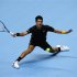 Serbia's Djokovic returns the ball during his singles tennis match against France's Tsonga at the ATP World Tour Finals in the O2 Arena in London