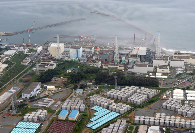FILE - In this Tuesday, Aug. 20, 2013 file aerial photo, the Fukushima Dai-ichi nuclear plant is seen at Okuma in Fukushima prefecture, northern Japan. The storage tank problems have captured international attention, especially since August, when a 1,000-ton tank lost nearly one-third of its toxic content. A month earlier, the plant’s operator, Tokyo Electric Power Co., acknowledged that much larger amounts of contaminated underground water at the site have been leaking into the Pacific for some time. (AP Photo/Kyodo News, File) JAPAN OUT, MANDATORY CREDIT
