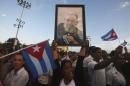 People pay homage to the late Cuban leader Fidel Castro during the last ceremony before his burial in Santiago de Cuba -the cradle of his revolution- on December 3, 2016