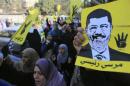 Supporters of Muslim Brotherhood and ousted Egyptian President Mursi shout slogans against military and interior ministry in front of Al Rayyan mosque after Friday prayers in the southern suburb of Maadi, outskirts of Cairo